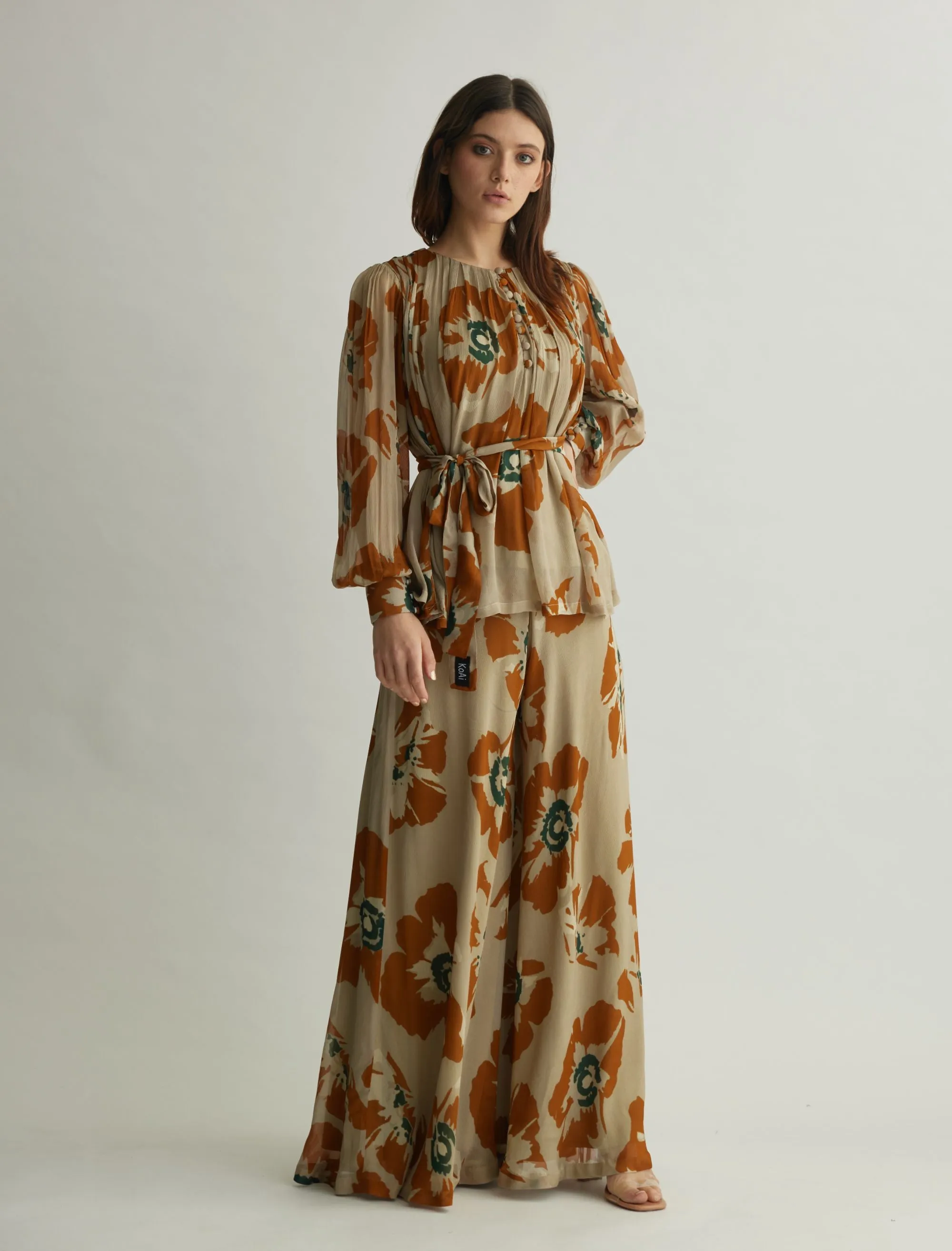 BEIGE AND RUST FLORAL FLARED PANTS
