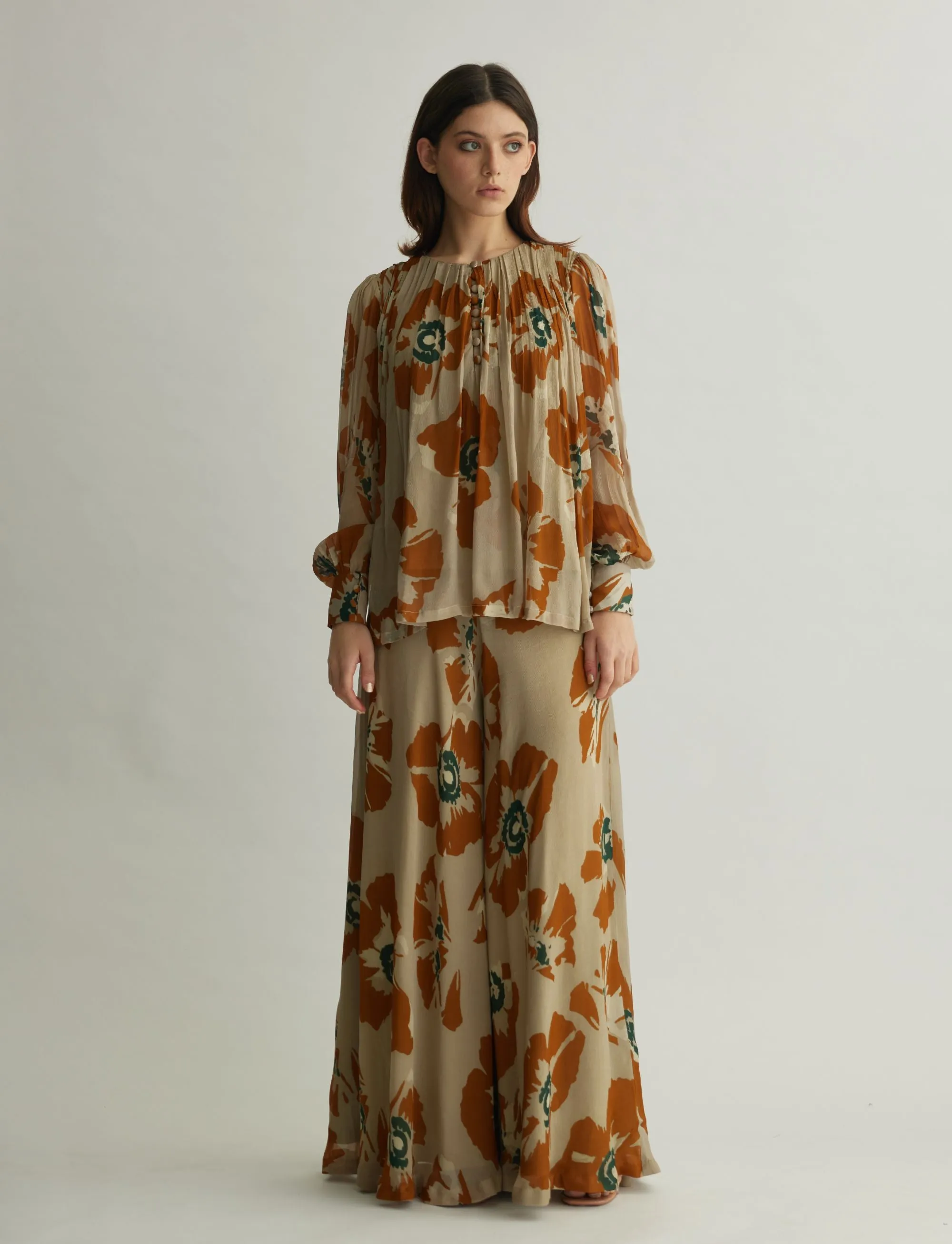 BEIGE AND RUST FLORAL FLARED PANTS