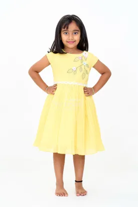 Girls Poly Georgette Frock in Sunshine Yellow with Floral Embellishments and Pleats
